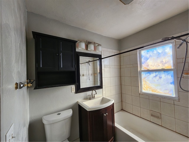 full bathroom featuring plenty of natural light, vanity, a textured ceiling, and toilet