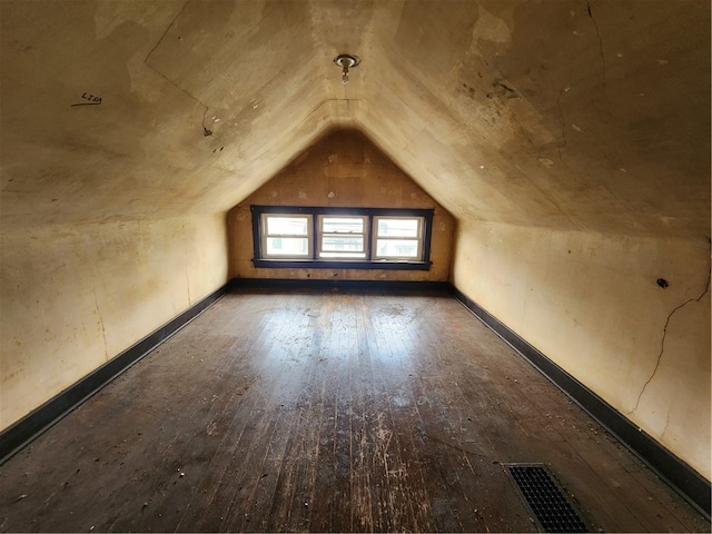 bonus room featuring hardwood / wood-style floors and lofted ceiling