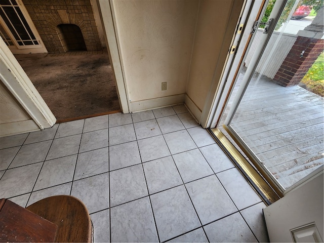 interior space featuring tile patterned flooring and a fireplace