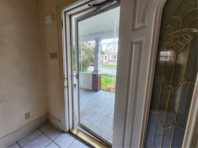 entryway featuring light tile patterned floors