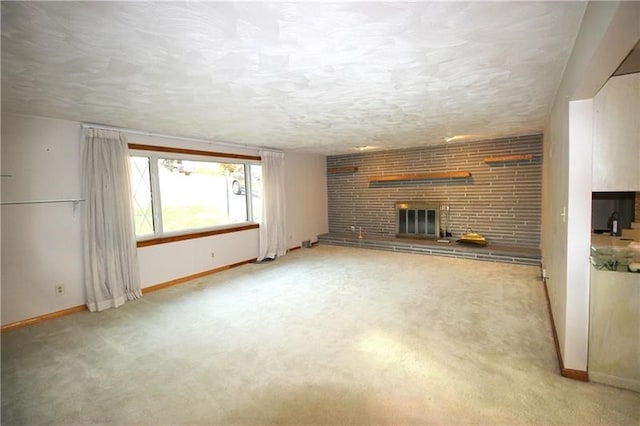 unfurnished living room featuring a brick fireplace and carpet flooring