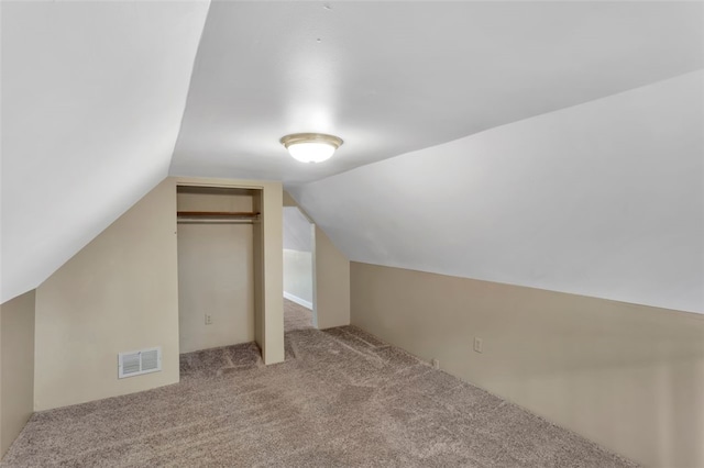 bonus room featuring light colored carpet and lofted ceiling