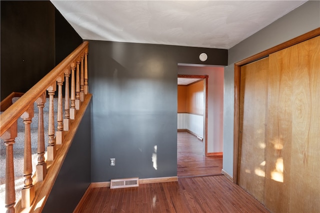 staircase featuring hardwood / wood-style floors