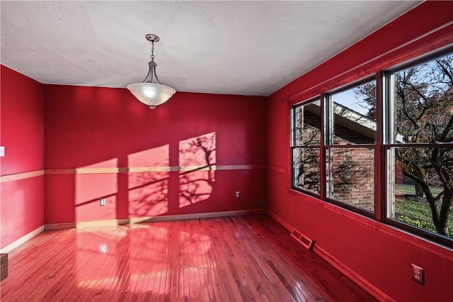 unfurnished dining area with hardwood / wood-style flooring