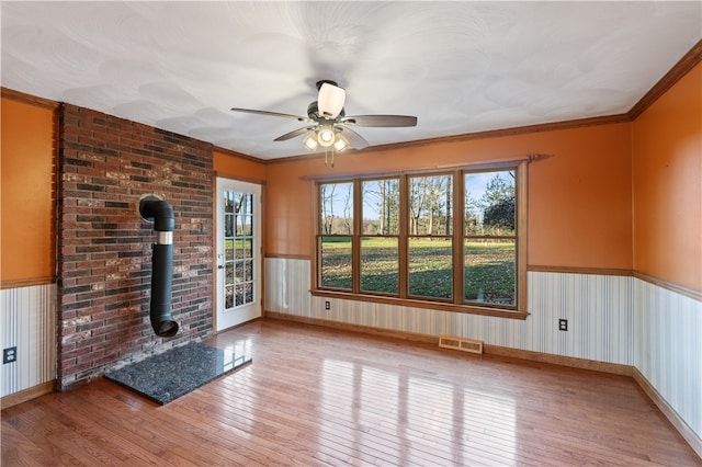 unfurnished living room featuring light hardwood / wood-style floors, a healthy amount of sunlight, and ceiling fan