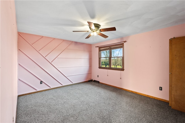 carpeted empty room with ceiling fan