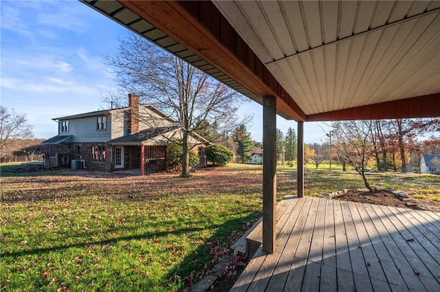 wooden terrace with central AC unit and a lawn