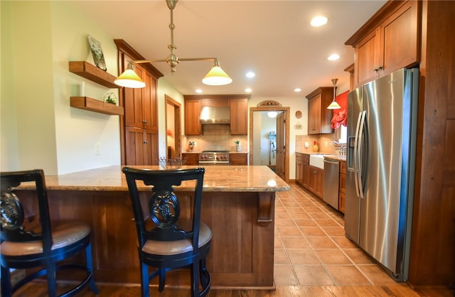 532 W Sunbury Rd, Center Twp But, PA 16001 - kitchen featuring a kitchen bar, ventilation hood, hanging light fixtures, appliances with stainless steel finishes, and light stone counters