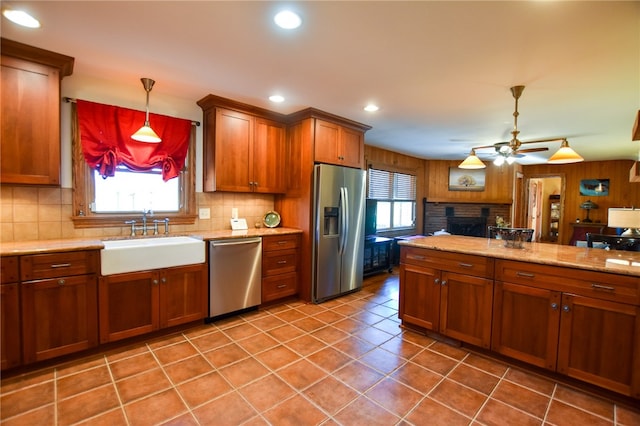 532 W Sunbury Rd, Center Twp But, PA 16001 - kitchen featuring hanging light fixtures, sink, ceiling fan, a fireplace, and appliances with stainless steel finishes
