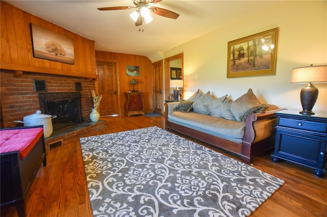 532 W Sunbury Rd, Center Twp But, PA 16001 - living room featuring a fireplace, dark hardwood / wood-style flooring, ceiling fan, and wood walls