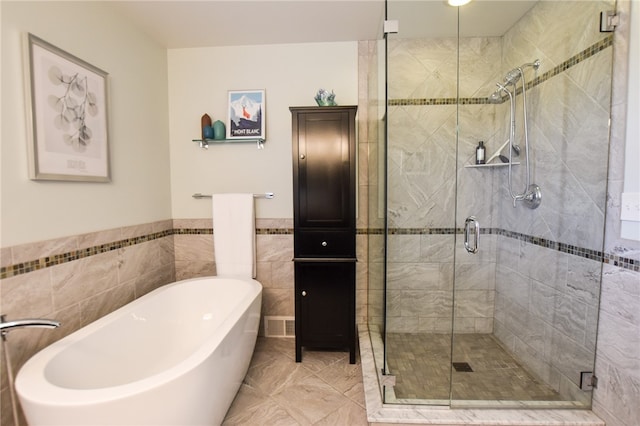 532 W Sunbury Rd, Center Twp But, PA 16001 - bathroom featuring plus walk in shower and tile walls
