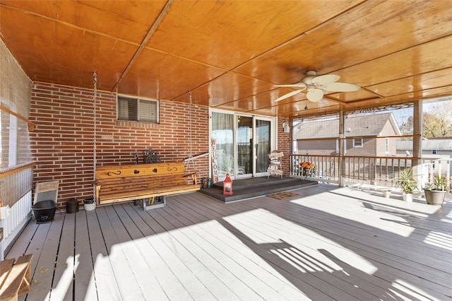 wooden terrace featuring ceiling fan