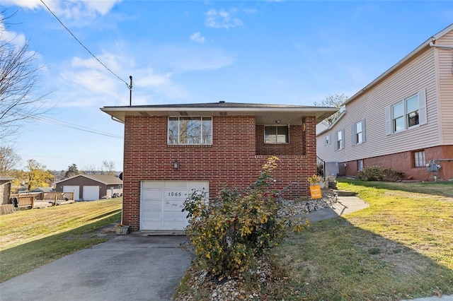 view of front facade with driveway, a front lawn, and brick siding