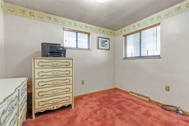 bedroom featuring baseboard heating and carpet flooring