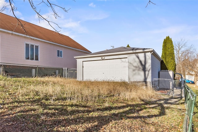 view of home's exterior with an outbuilding