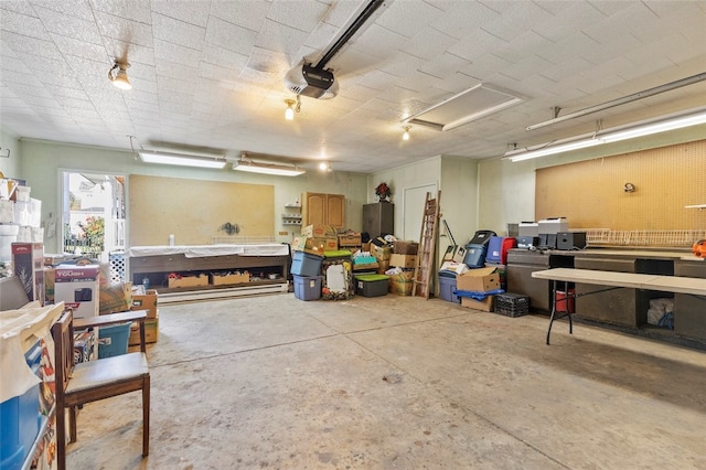 garage featuring a workshop area and a garage door opener