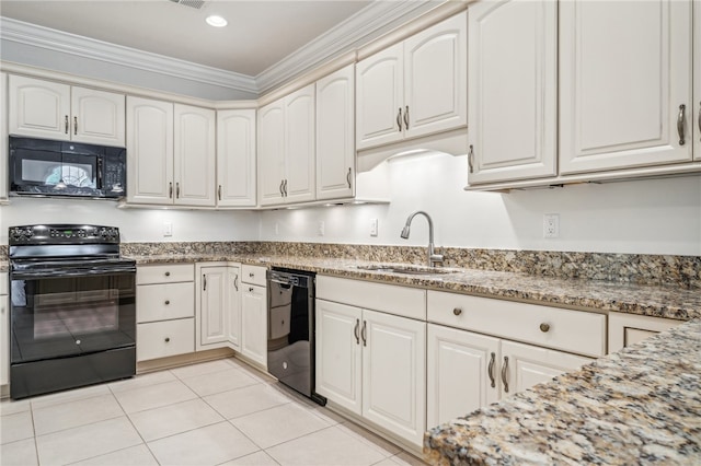 kitchen with black appliances, light stone counters, crown molding, white cabinetry, and sink