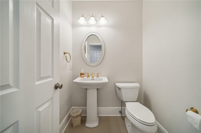 bathroom featuring tile patterned floors and toilet