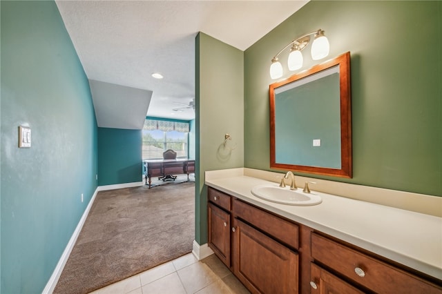 bathroom with vanity, ceiling fan, tile patterned flooring, and a textured ceiling