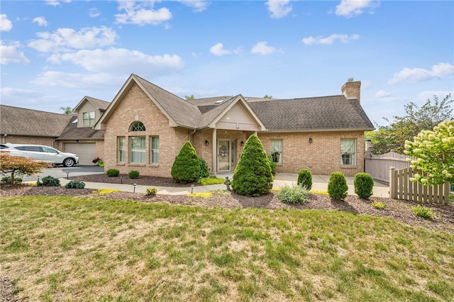 view of front of house with a front lawn and a garage