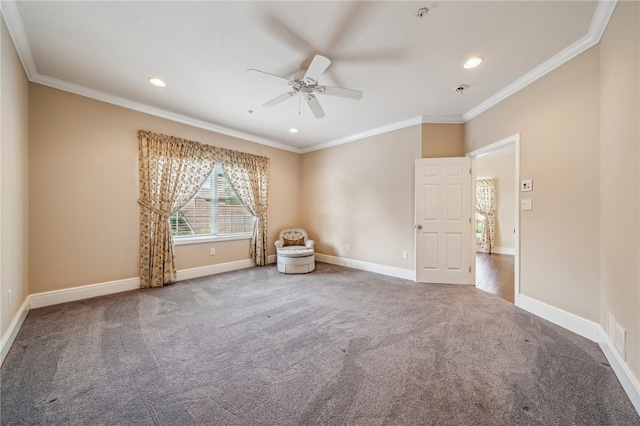 empty room featuring ceiling fan, carpet flooring, and ornamental molding