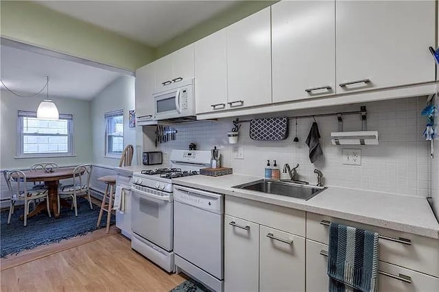 82 Laclede St, Mt Washington, PA 15211 - kitchen featuring white appliances, light countertops, decorative backsplash, and white cabinetry