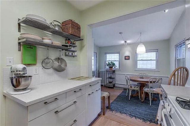82 Laclede St, Mt Washington, PA 15211 - kitchen featuring white cabinetry, light wood-style floors, tasteful backsplash, open shelves, and radiator heating unit
