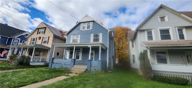 view of front facade with a porch and a front lawn