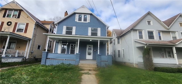 view of front facade with a porch and a front yard