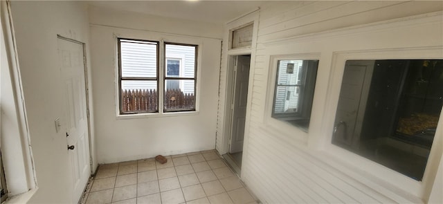 empty room with light tile patterned floors