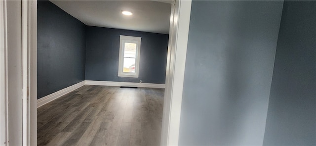 unfurnished room featuring hardwood / wood-style flooring