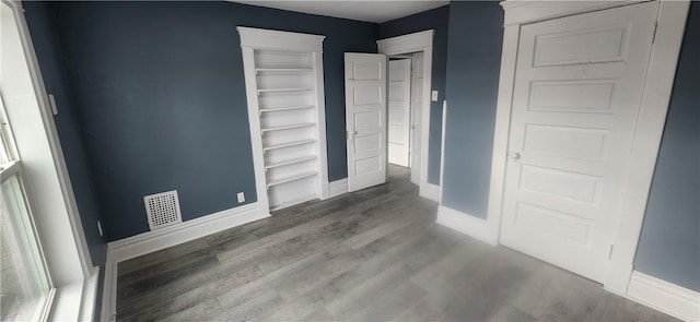 spare room featuring hardwood / wood-style floors