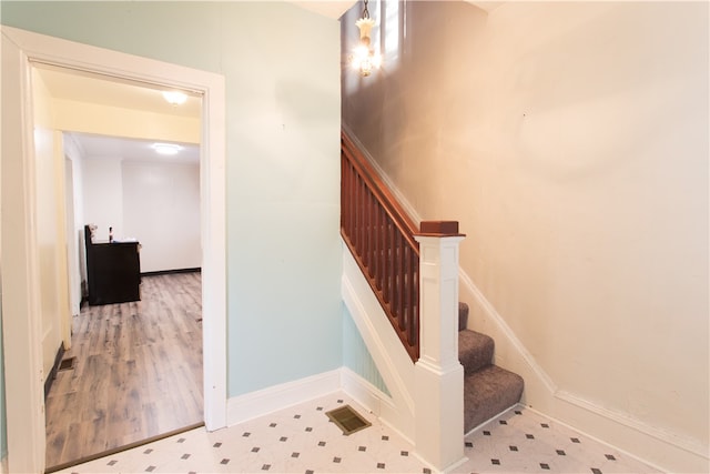 stairway with wood-type flooring