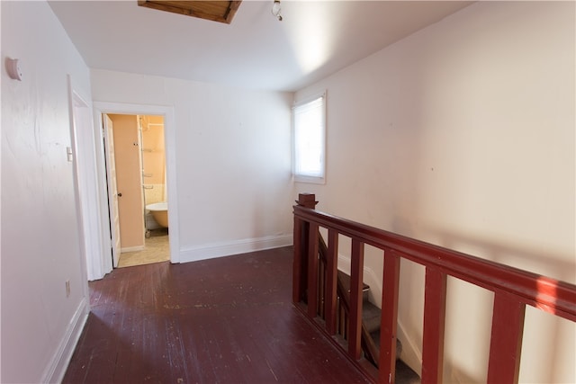 hallway featuring dark hardwood / wood-style flooring