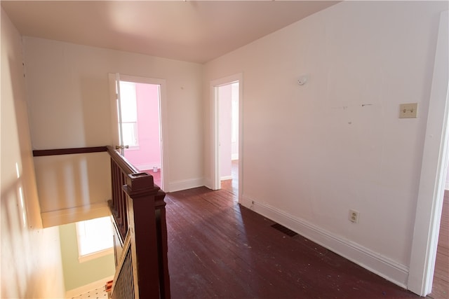 spare room with dark wood-type flooring