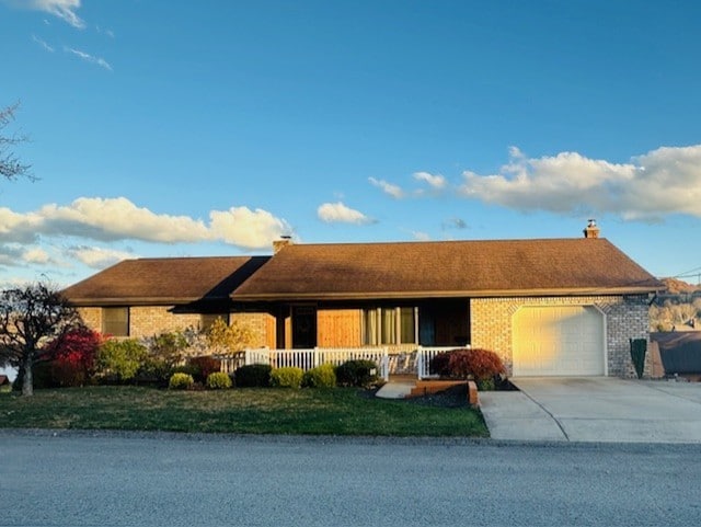 single story home with a garage and a porch