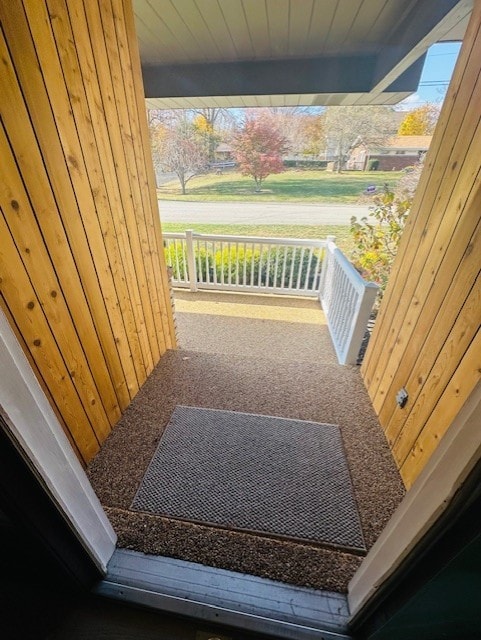 exterior details with wooden walls and carpet flooring