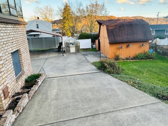 view of patio with a shed