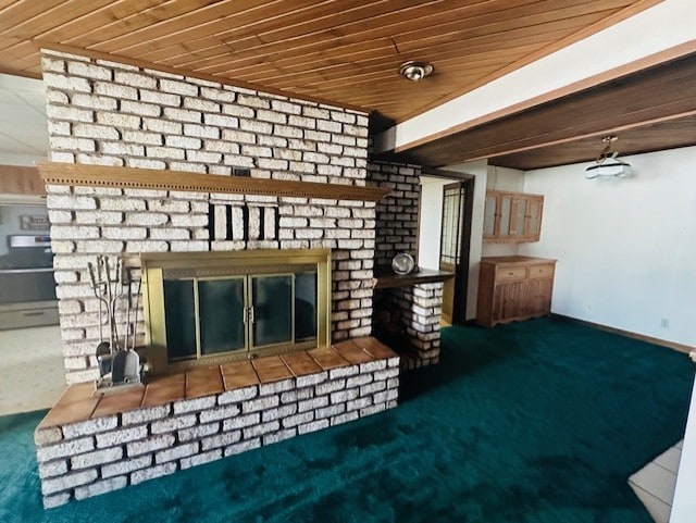 unfurnished living room with a fireplace, carpet, and wooden ceiling