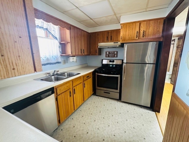 kitchen featuring a drop ceiling, appliances with stainless steel finishes, and sink