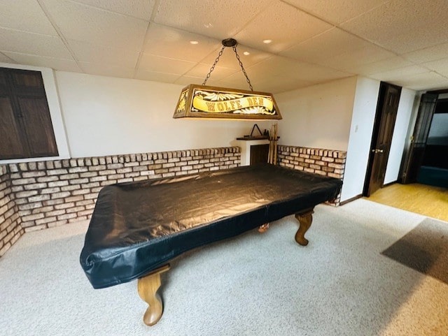 playroom with a drop ceiling, billiards, light colored carpet, and brick wall