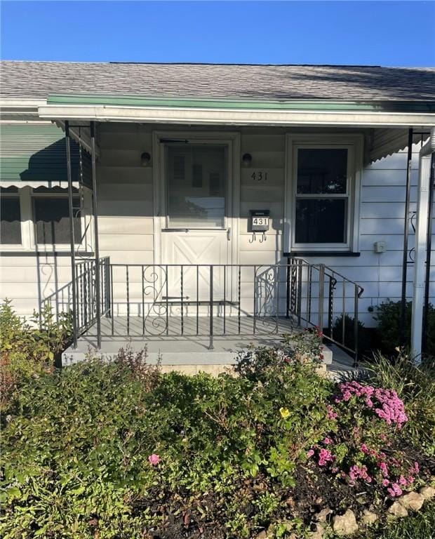 property entrance featuring covered porch