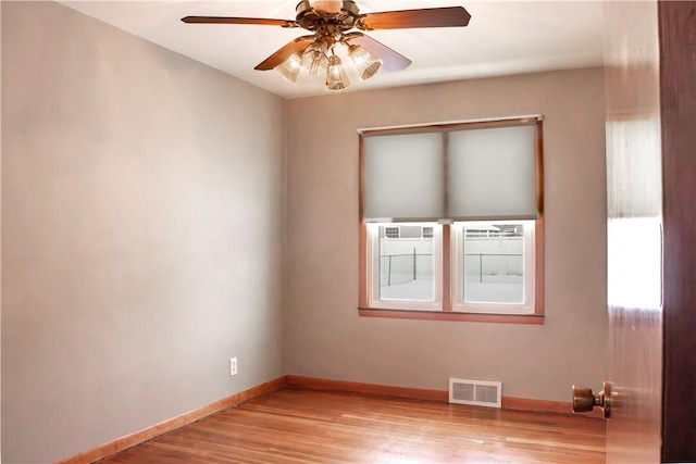 unfurnished room with ceiling fan and light wood-type flooring