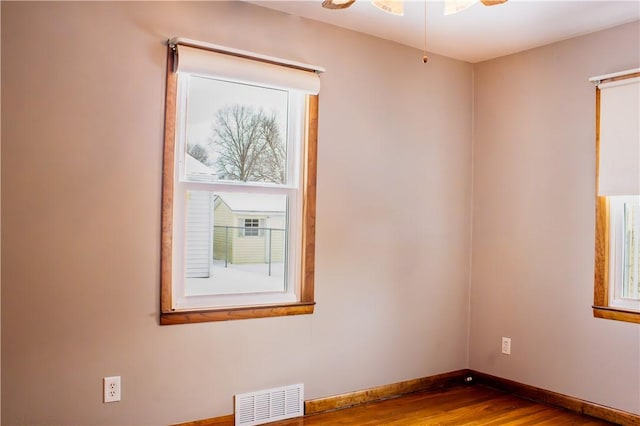 spare room with hardwood / wood-style flooring