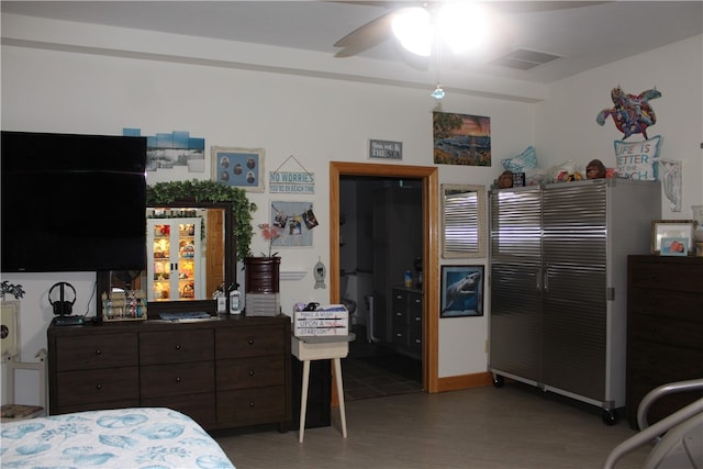 bedroom with ceiling fan and wood-type flooring