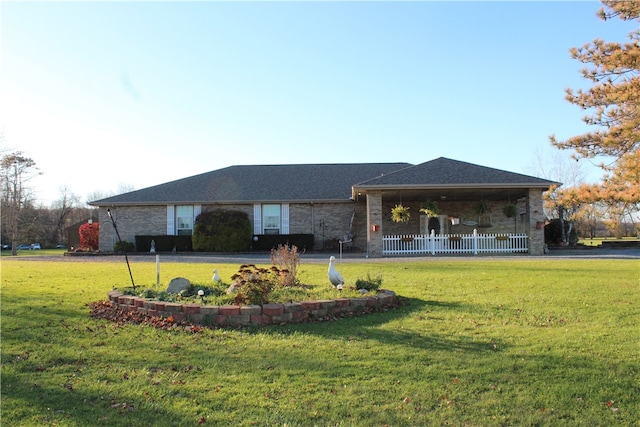 view of home's community featuring a lawn