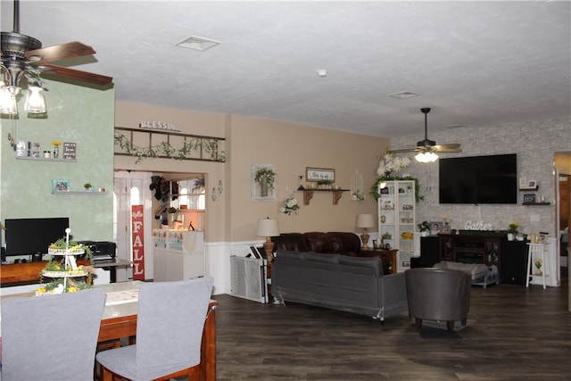 dining room featuring ceiling fan and dark hardwood / wood-style floors