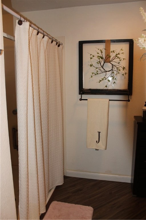 bathroom with wood-type flooring