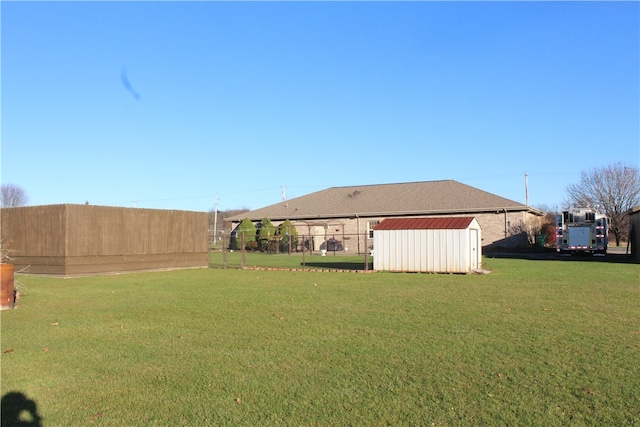 view of yard featuring a storage unit