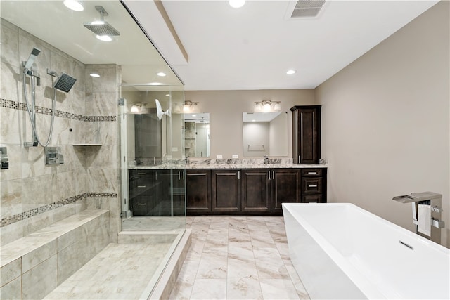 bathroom with shower with separate bathtub and vanity